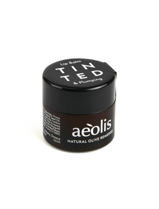 Tinted & Plumping Lip Balm – natural botanical lip care with hyaluronic acid and rosehip oil.