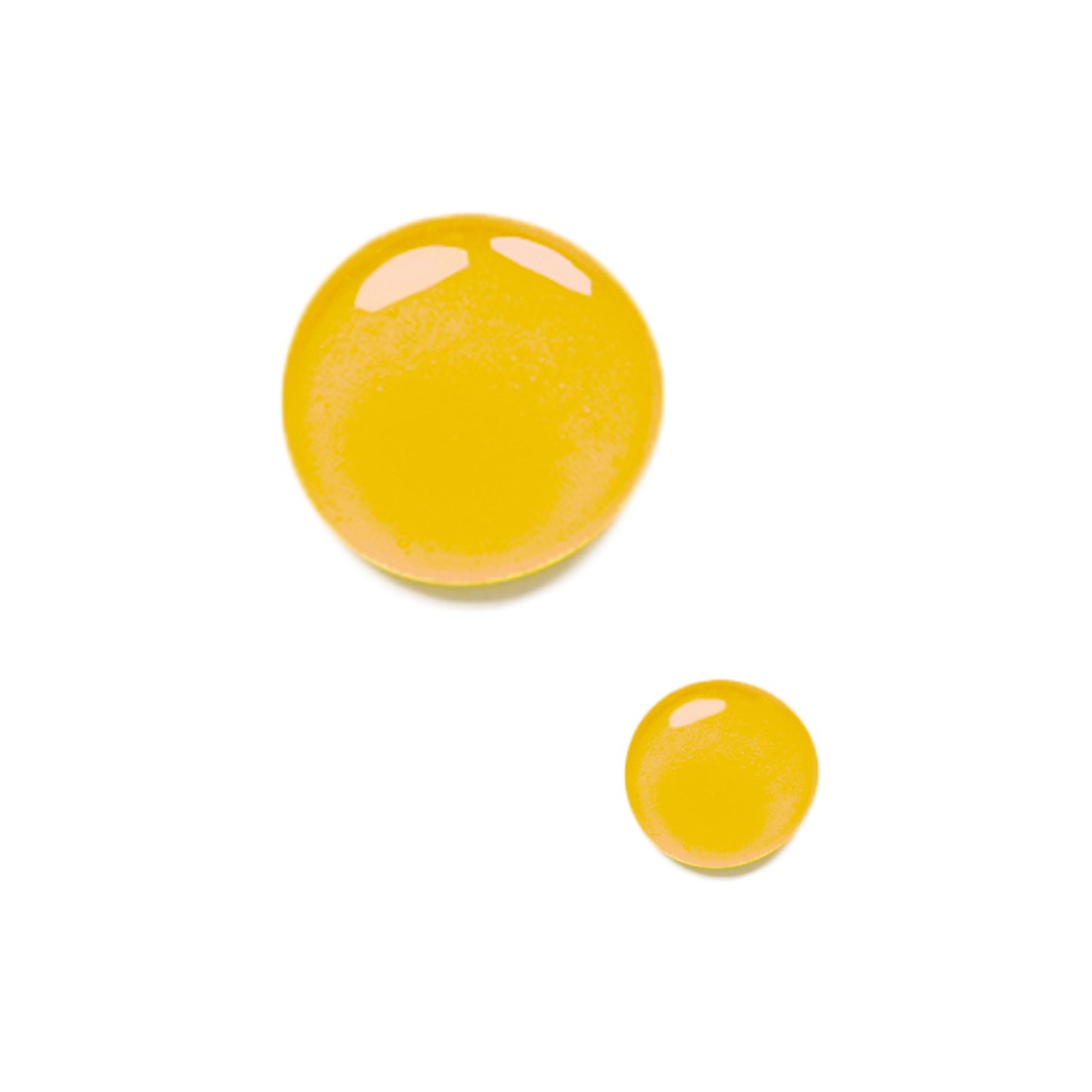 Close up of two drops of the Odacite Bl+C Pimples serum concentrate on a white background