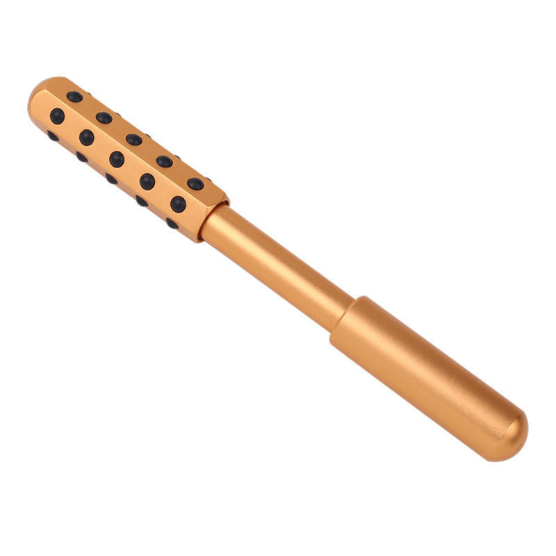 A metallic gold Jade & Germanium Facial Massage Roller with a textured head featuring black circular dots, shown against a plain white background.