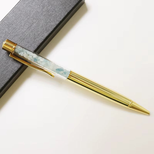 Aquamarine Infused Writing Pen – elegant pen filled with aquamarine crystals, symbol of calm, clarity, and creative flow.