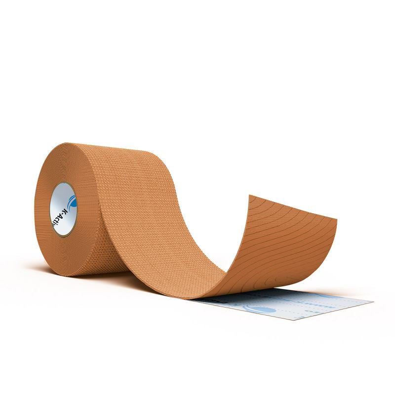 Beige kinesiology tape roll on a white background