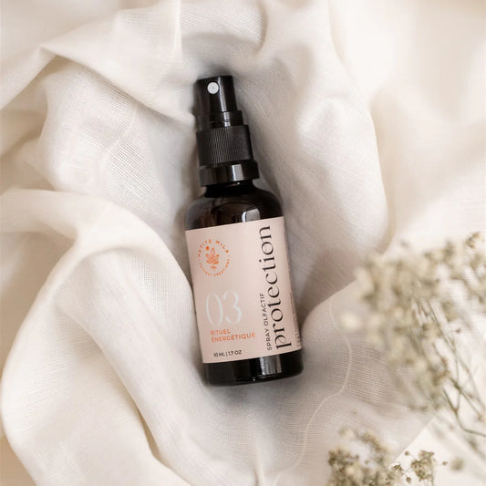 Bottle of Energetic Protection Mist — natural aura-cleansing spray with pine, lavender, and ylang-ylang essential oils.