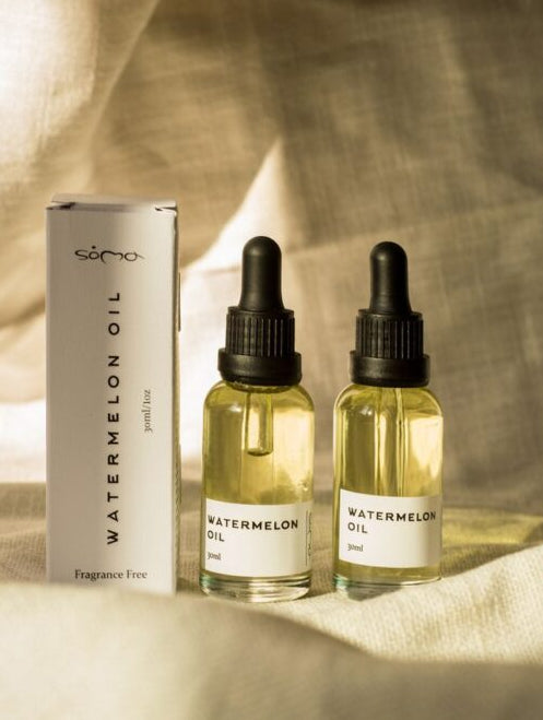 Two bottles of watermelon face oil. Natural Skincare for glow and hydration.