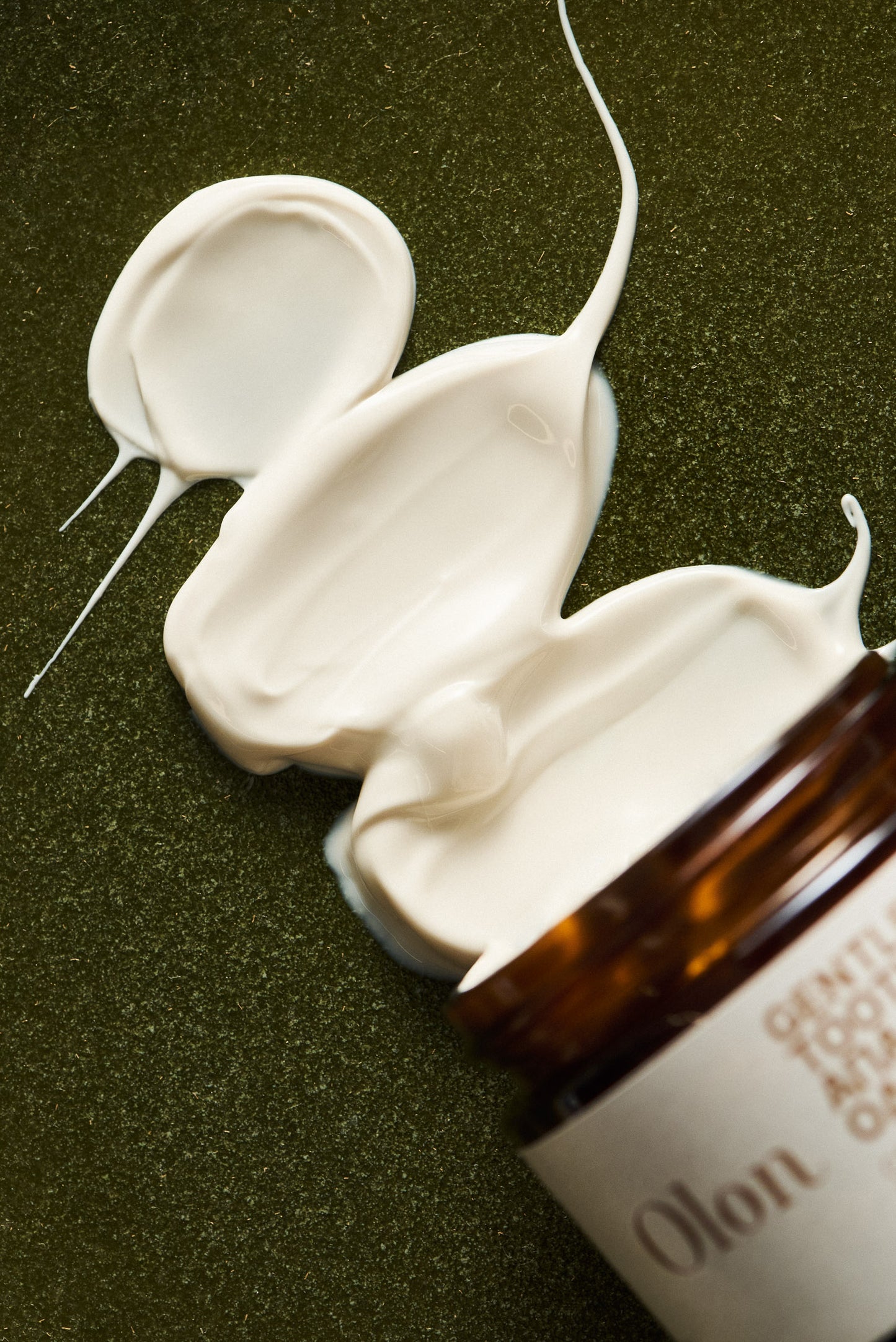 A spilled jar of Gentle Toothpaste by OLON