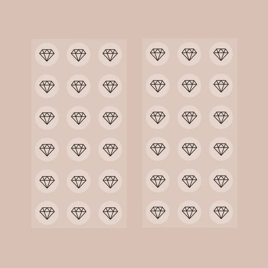 Two sheets of the Barriere biotin patch with patches with the black diamond symbol 