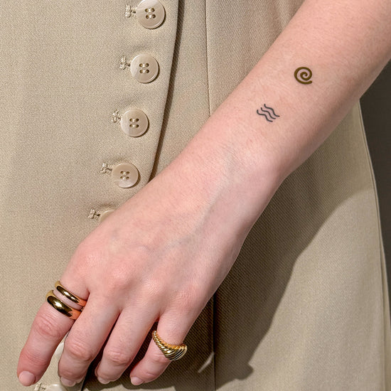 Close-up of a person wearing the Barriere Youth Repair clean NAD+ patch with metallic elements symbols