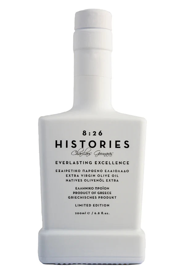 White bottle of 8:26 Histories olive oil on a white background