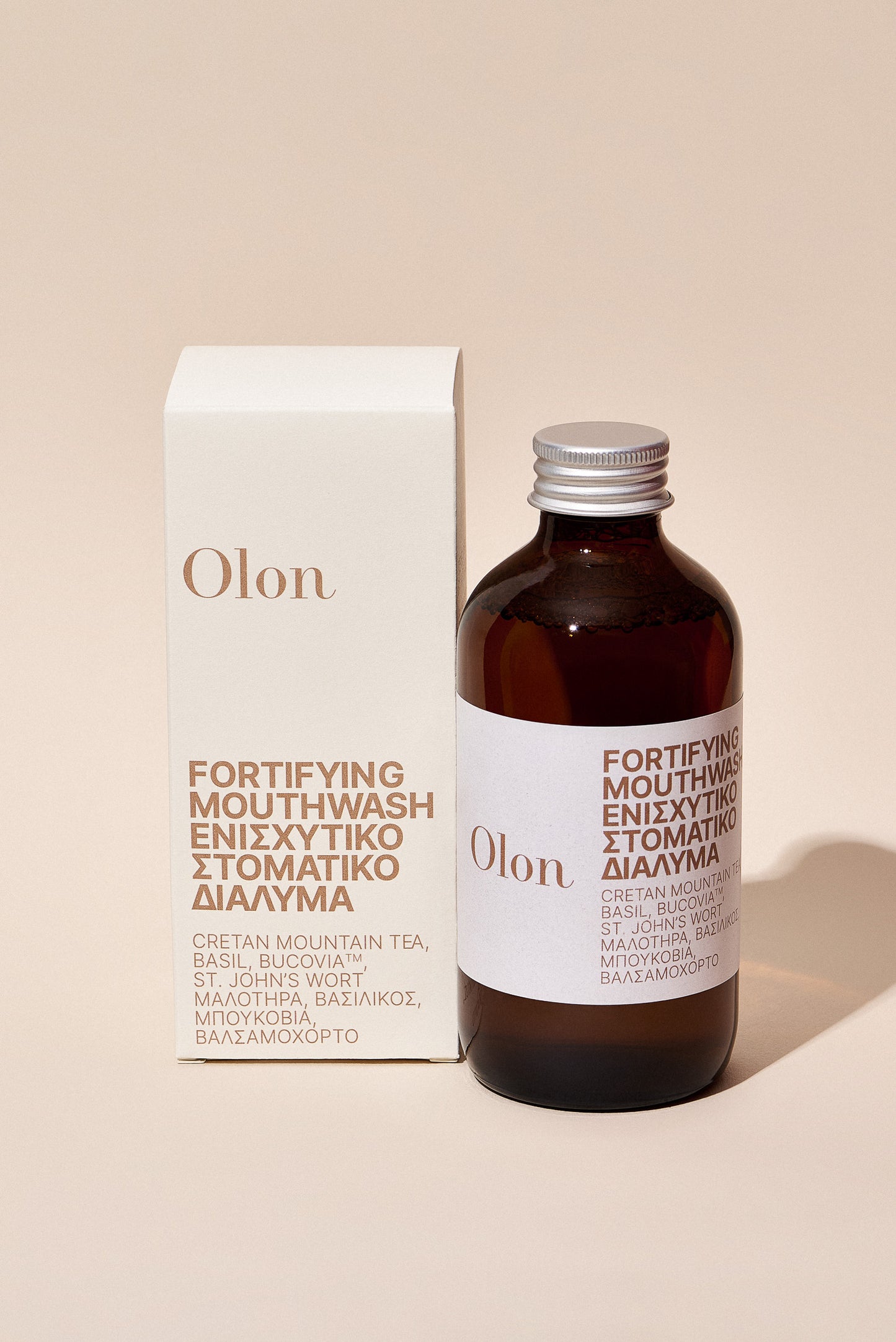 A bottle and the packaging of the Fortifying Mouthwash by Olon