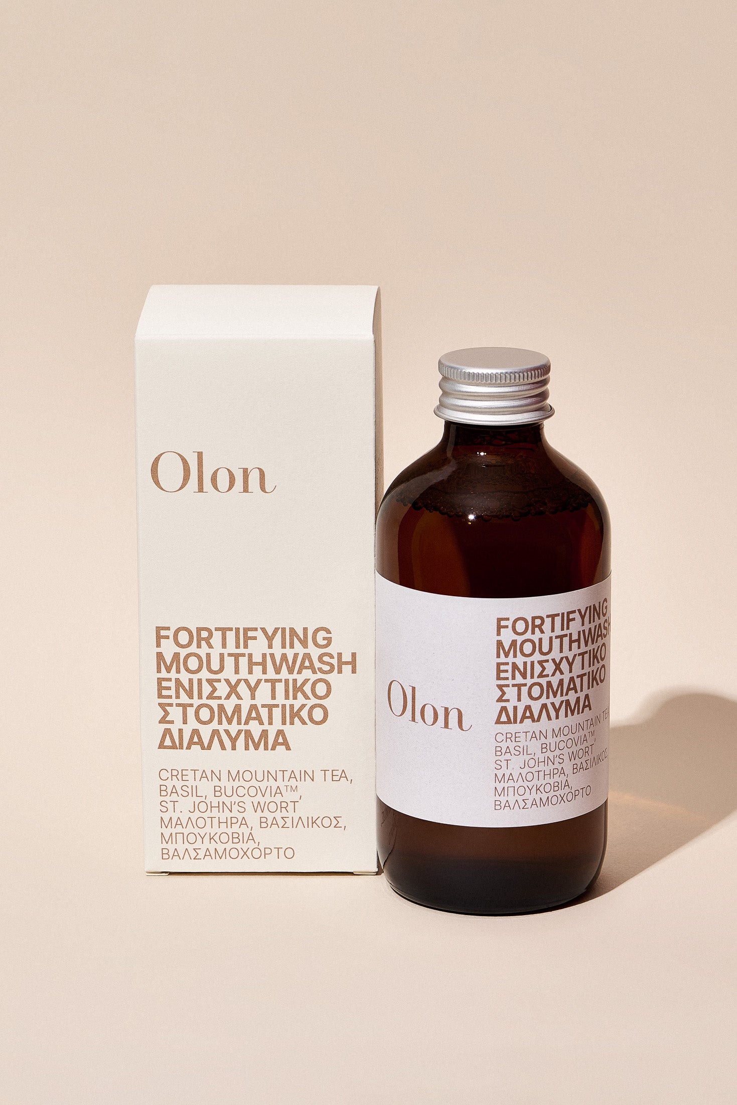 A bottle and the packaging of the Fortifying Mouthwash by Olon
