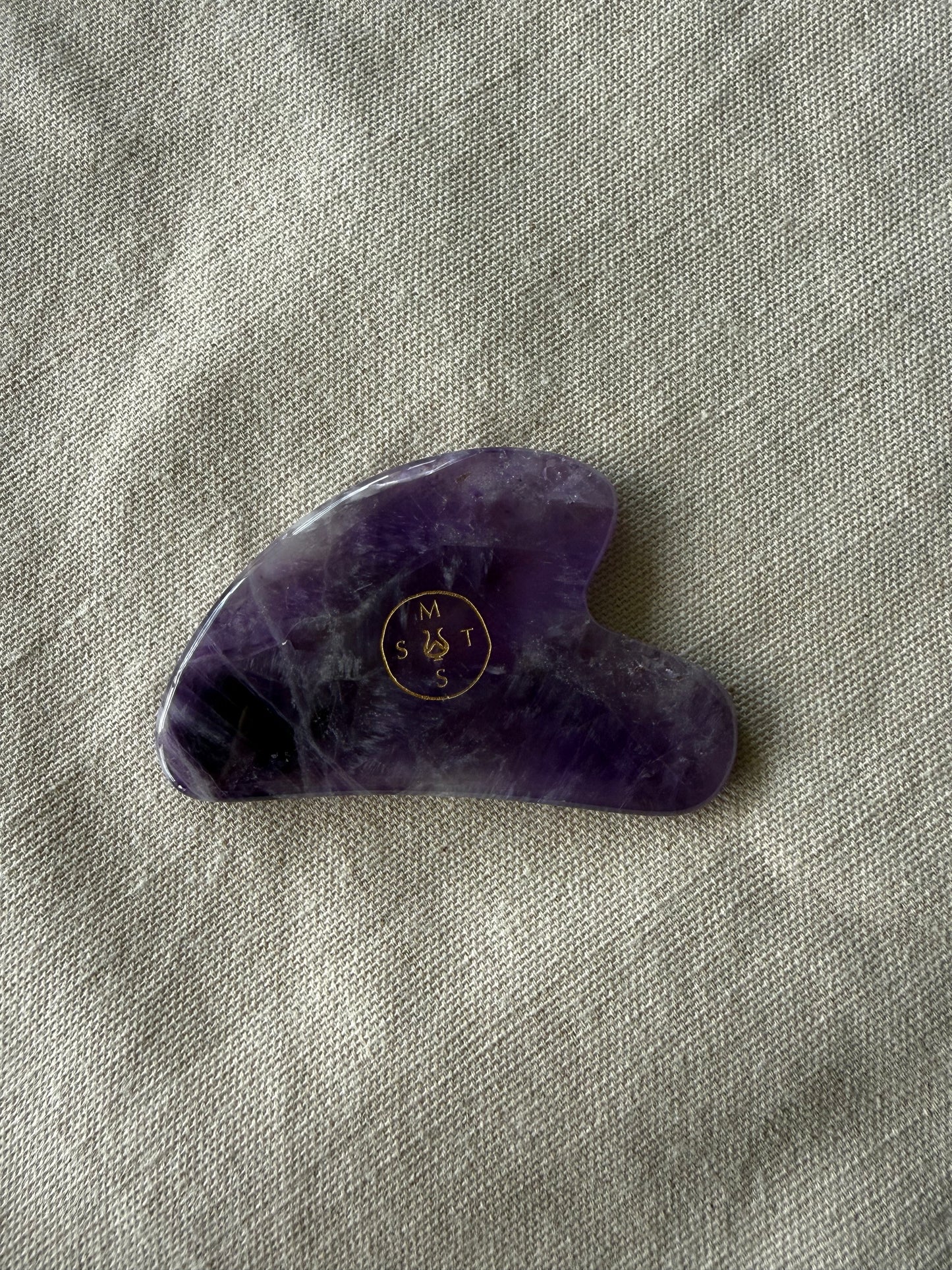     Premium amethyst gua sha facial tool designed to support circulation, lymphatic movement, and facial relaxation