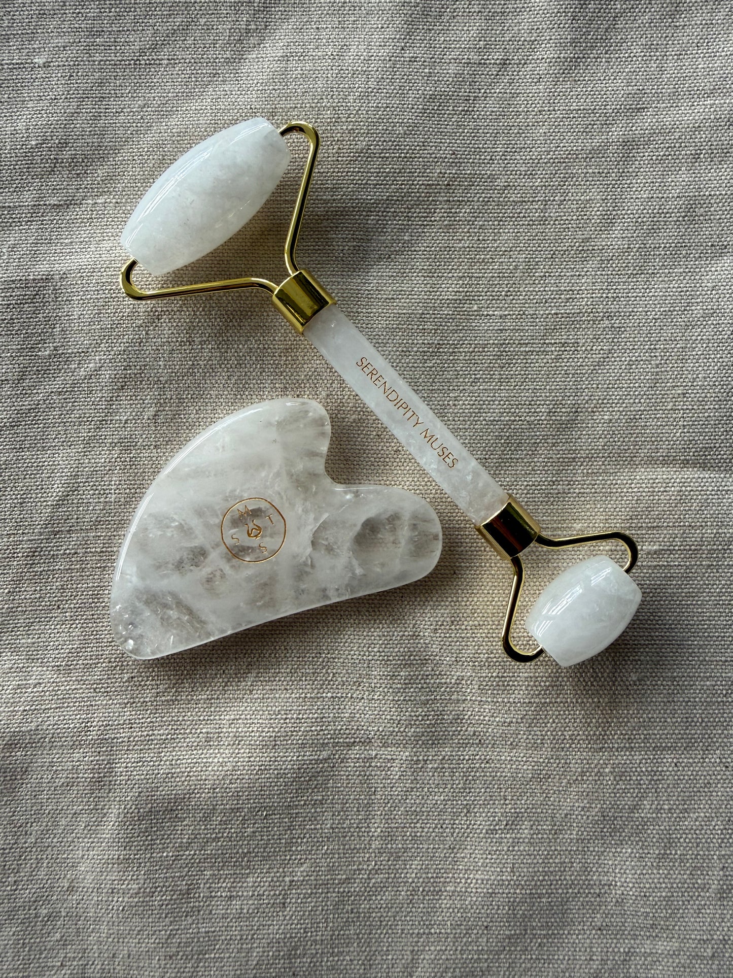     Natural clear quartz roller and gua sha duo for circulation and facial tension release