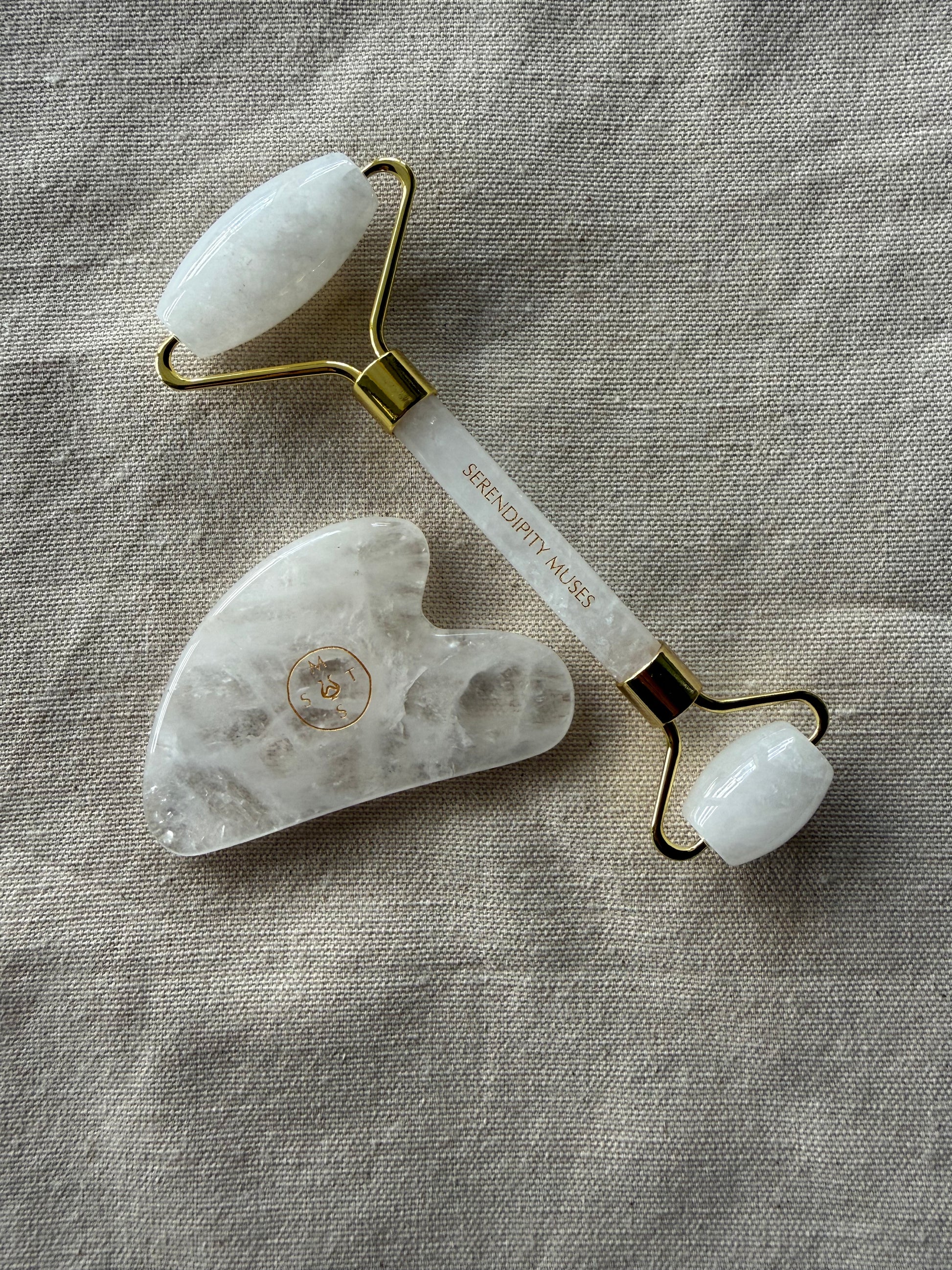     Natural clear quartz roller and gua sha duo for circulation and facial tension release