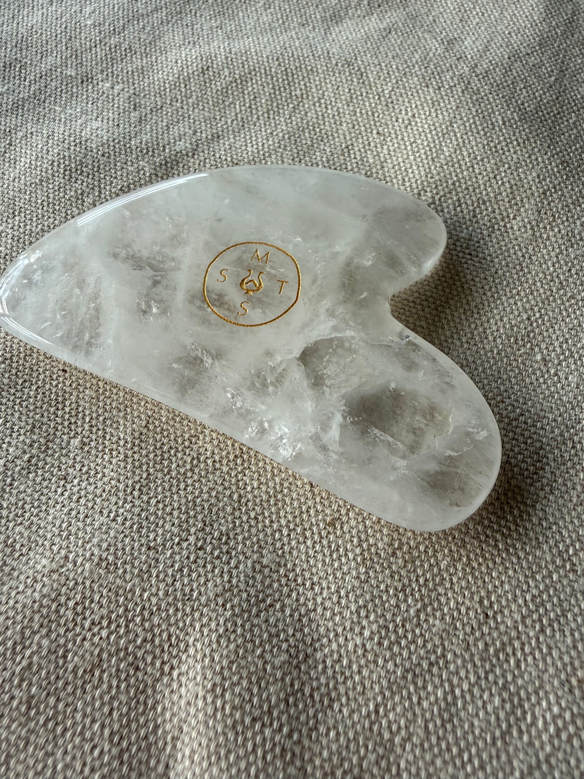     Natural stone facial massage gua sha made with luminous clear quartz for daily skincare rituals