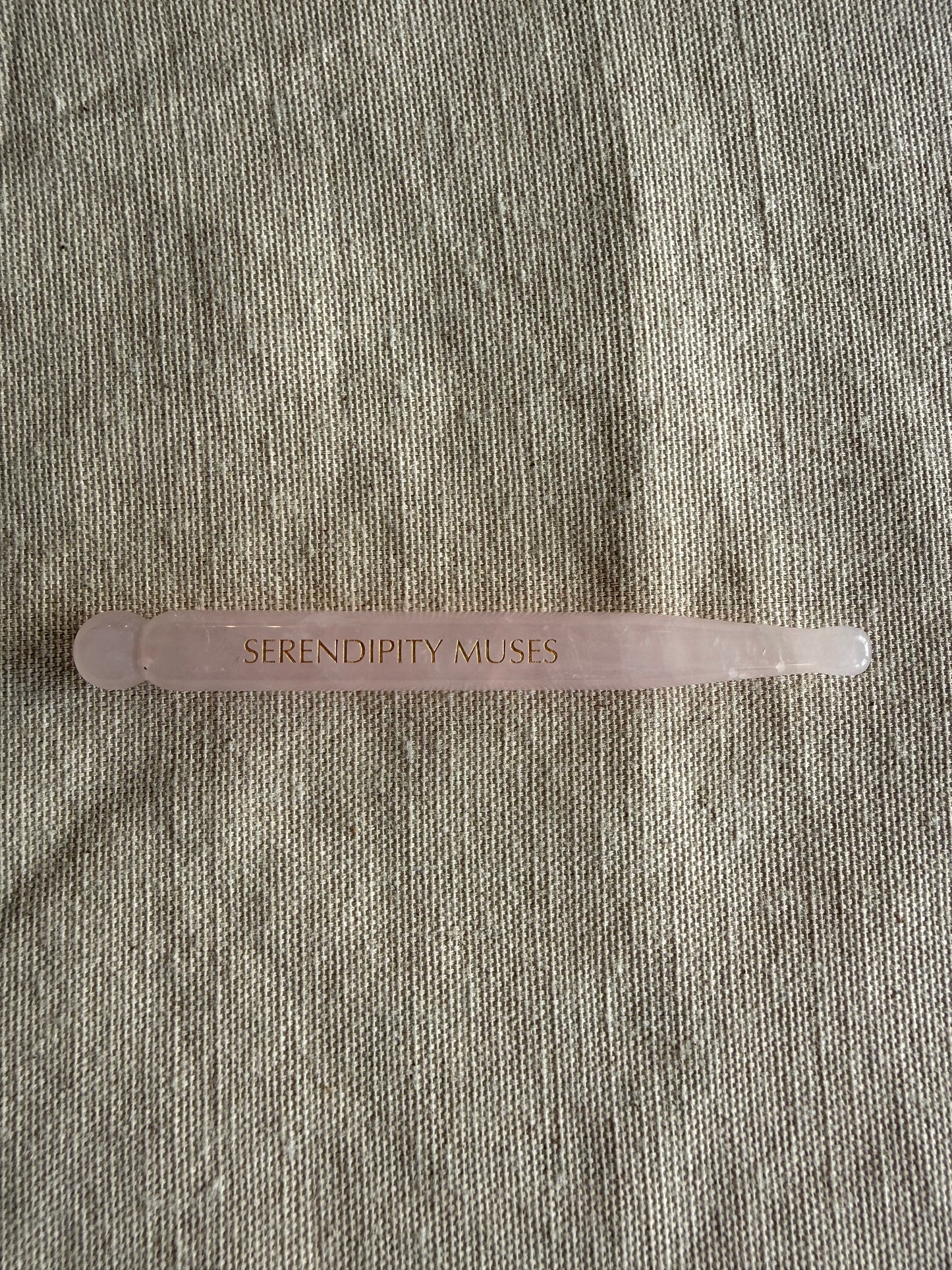     Handheld rose quartz facial massage pen with dual-ended sculpting design