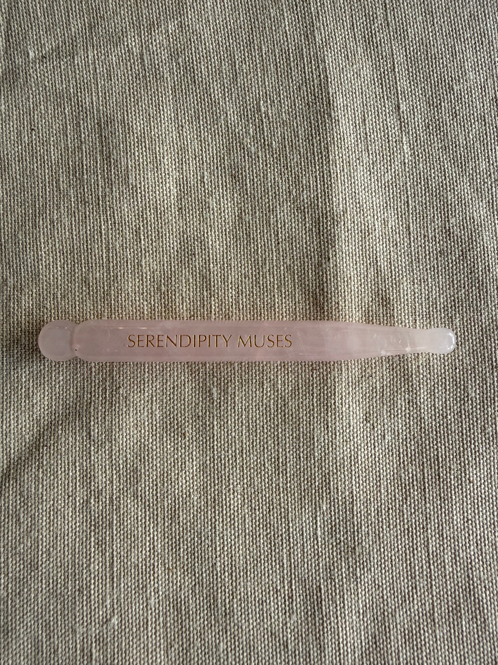     Handheld rose quartz facial massage pen with dual-ended sculpting design