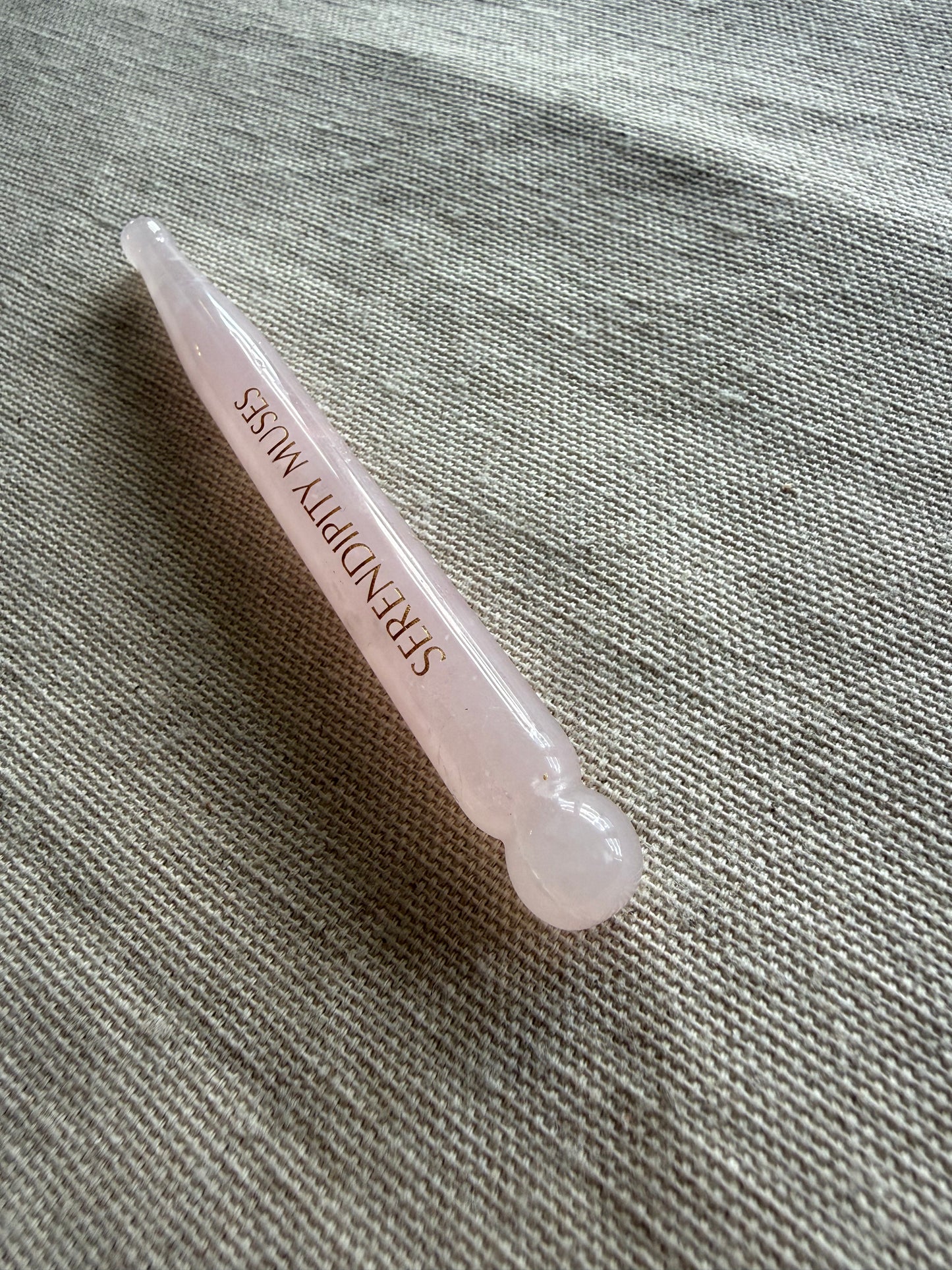     Luxury rose quartz Bo Jin face tool with precision massage points