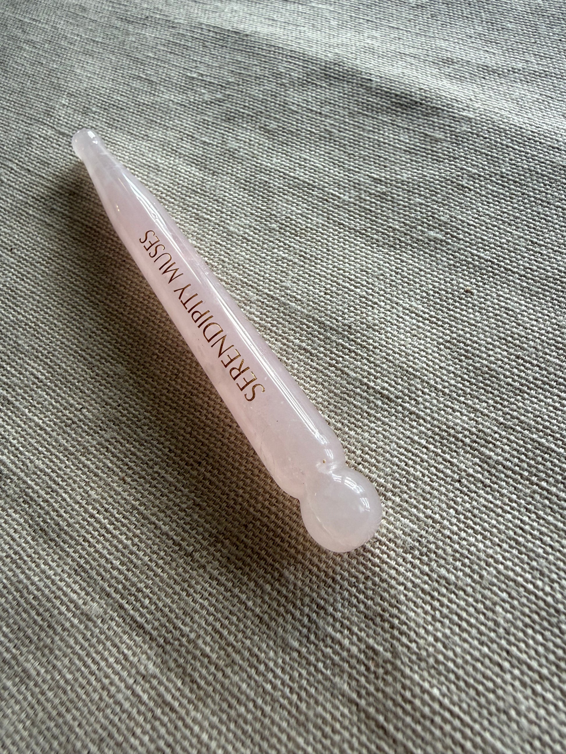     Luxury rose quartz Bo Jin face tool with precision massage points