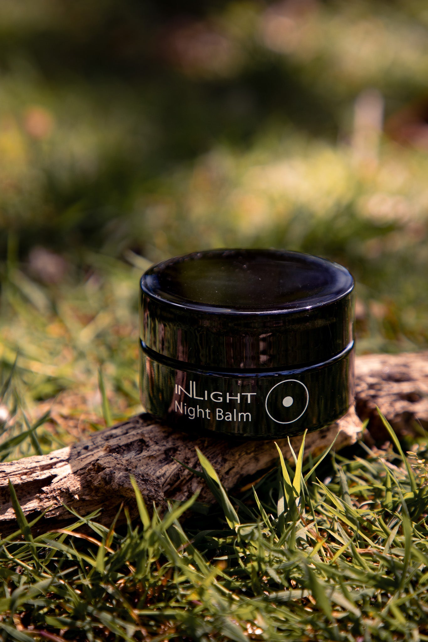  a jar of Inlight Face Cleanser in nature