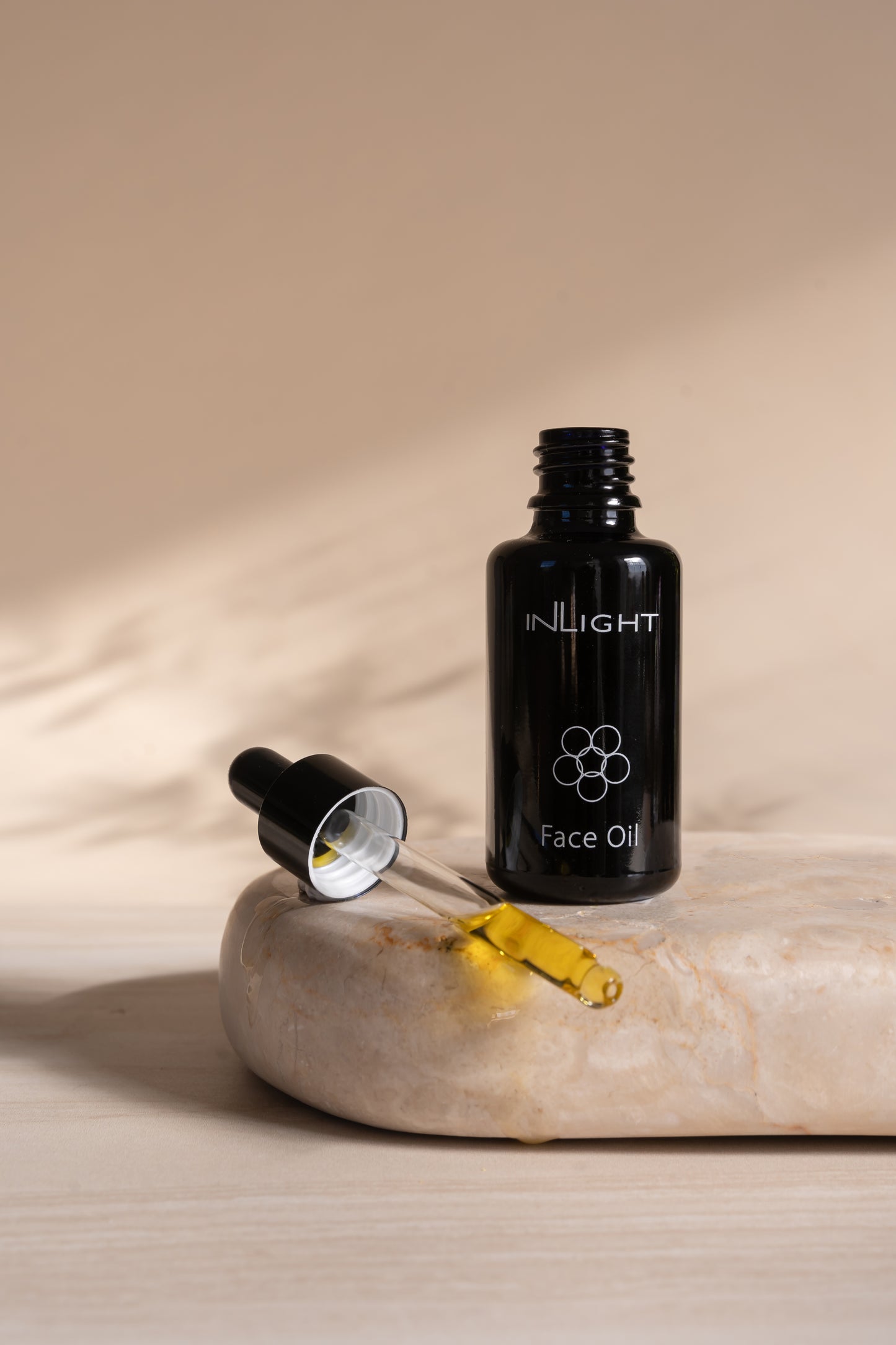 the Inlight Face Oil bottle 