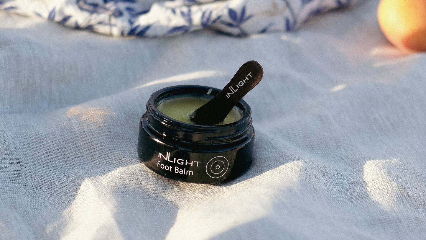 An open jar of Inlight Foot Balm 