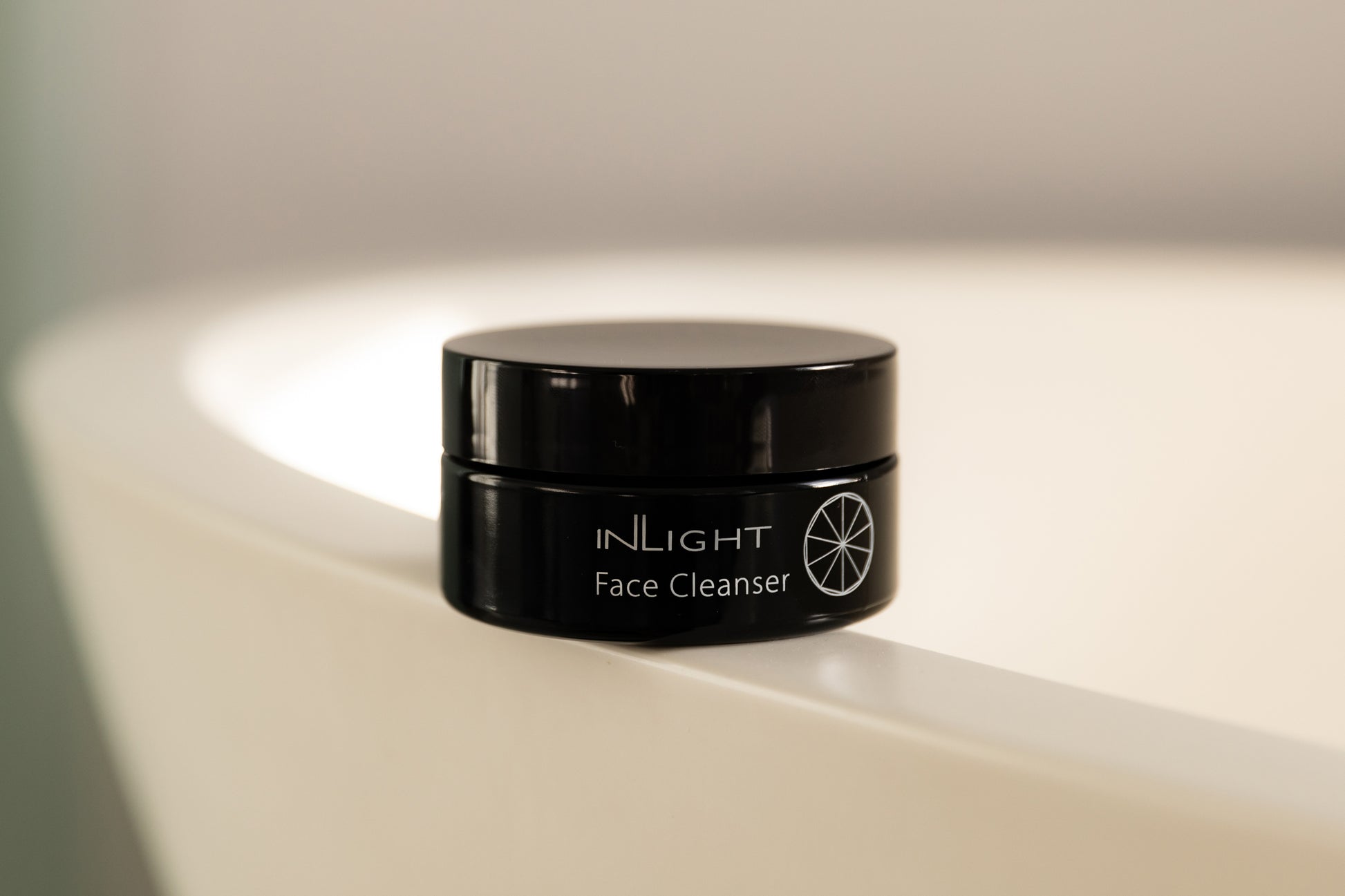  a jar of Inlight Face Cleanser