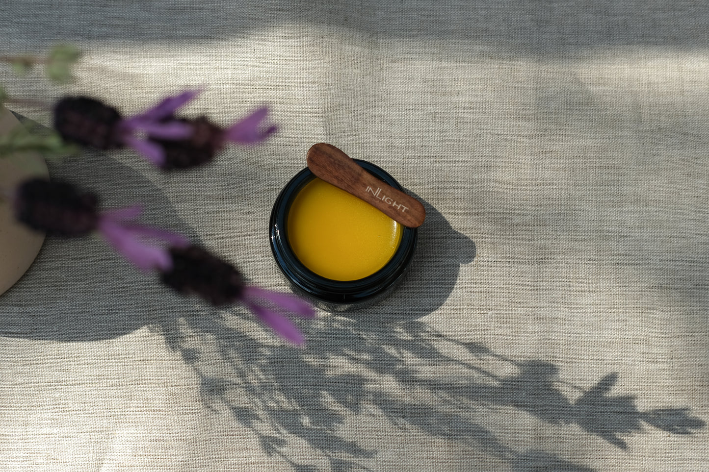 Black jar of inLight Night Balm 