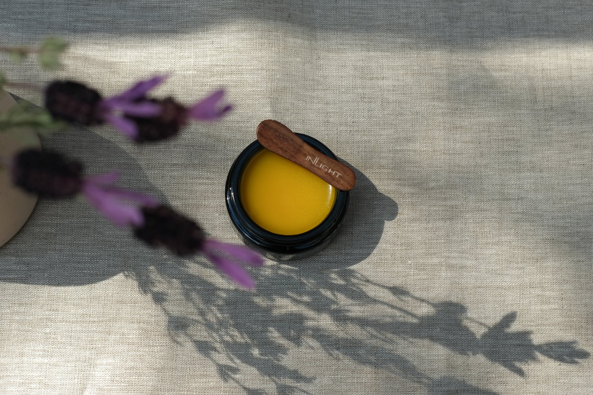 Black jar of inLight Night Balm 