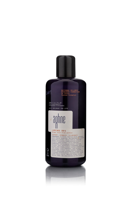 Bottle of aghne lumino 001 on a white background