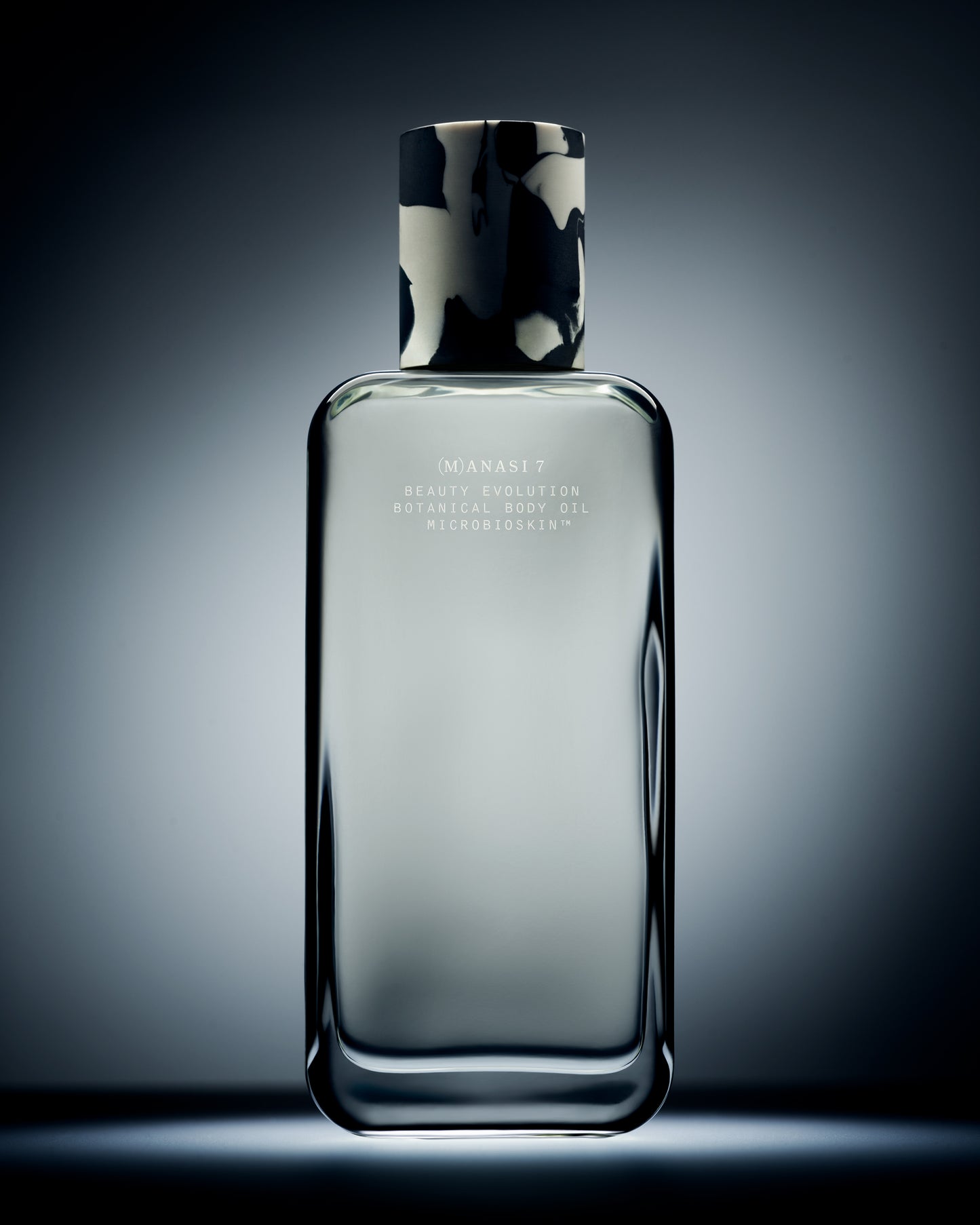 Glass bottle of the Manasi 7 Botanical Body Oil 