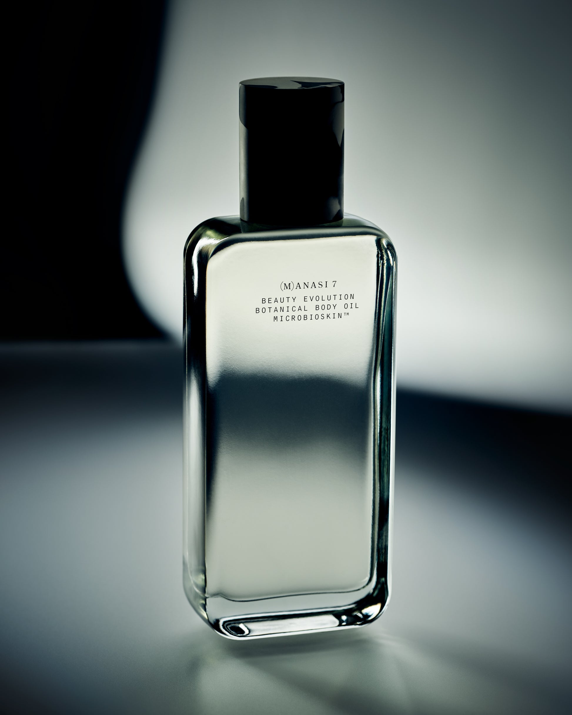 Glass bottle of the Manasi 7 Botanical Body Oil 