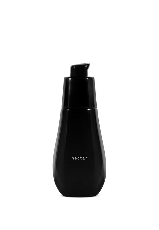 the black bottle of ayuna nectar on a white background