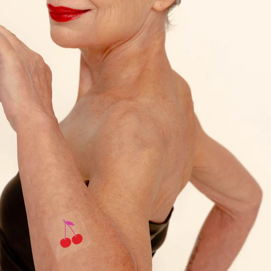 Person wearing Barriere skin support patch packaging with fruit designs