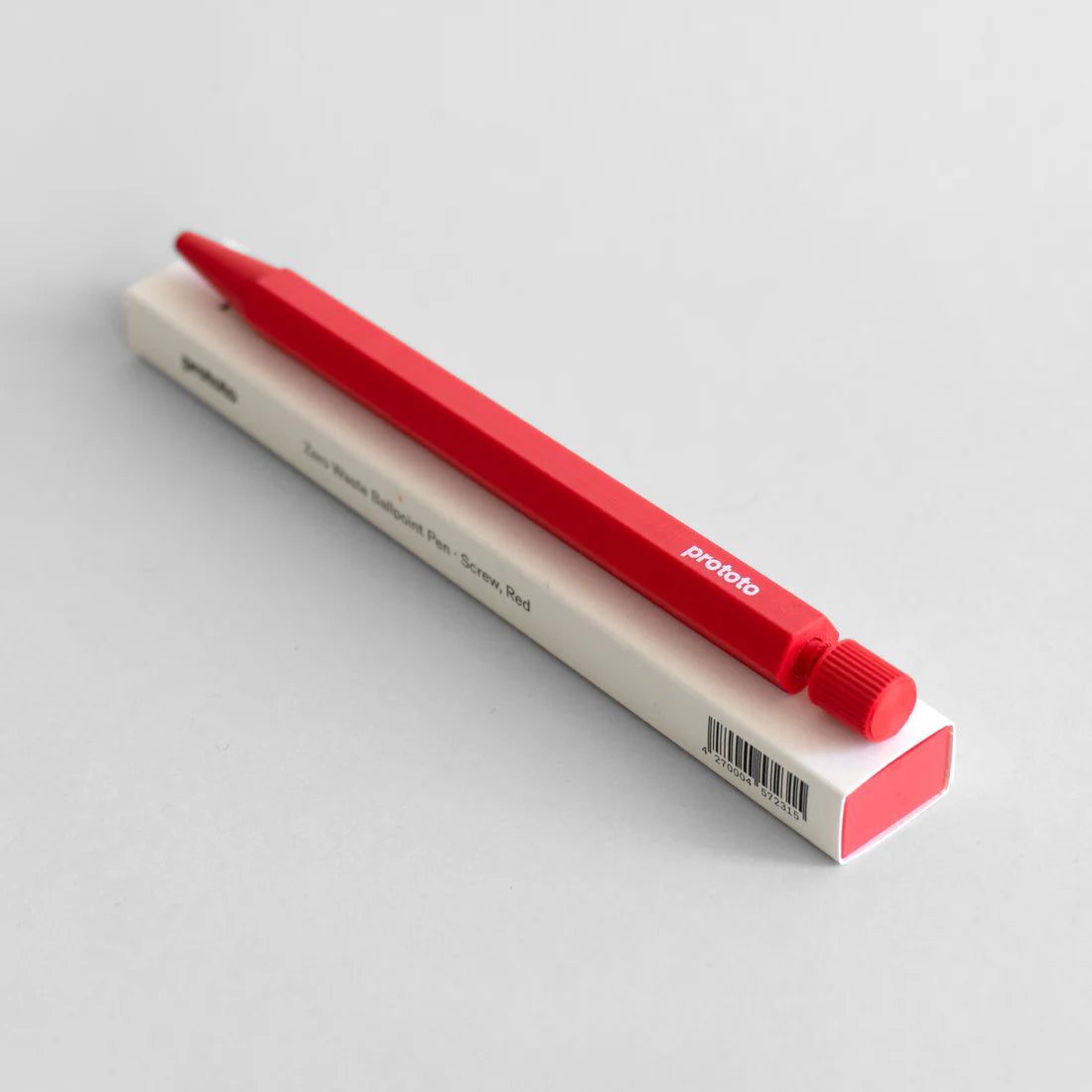 Red prototo pen on a white box against a light gray background