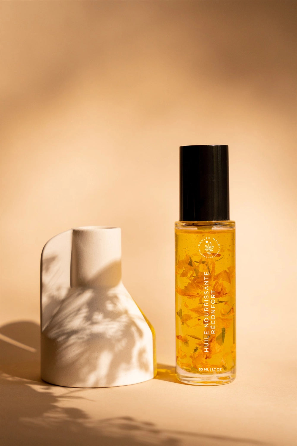 Comforting Belly Oil – organic aromatherapeutic body oil with neroli, cardamom, and lavender by Petite Mila, curated by Serendipity Muses.