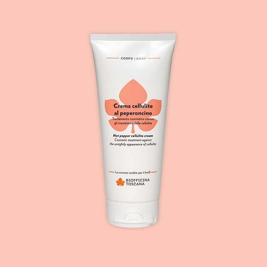 Tube of Biofficina Toscana Hot Pepper Cellulite Cream, a cosmetic treatment against the appearance of cellulite, displayed on a light peach background.