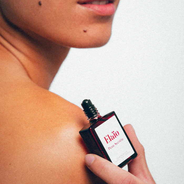 Peau Secrète perfume oil roll-on bottle 