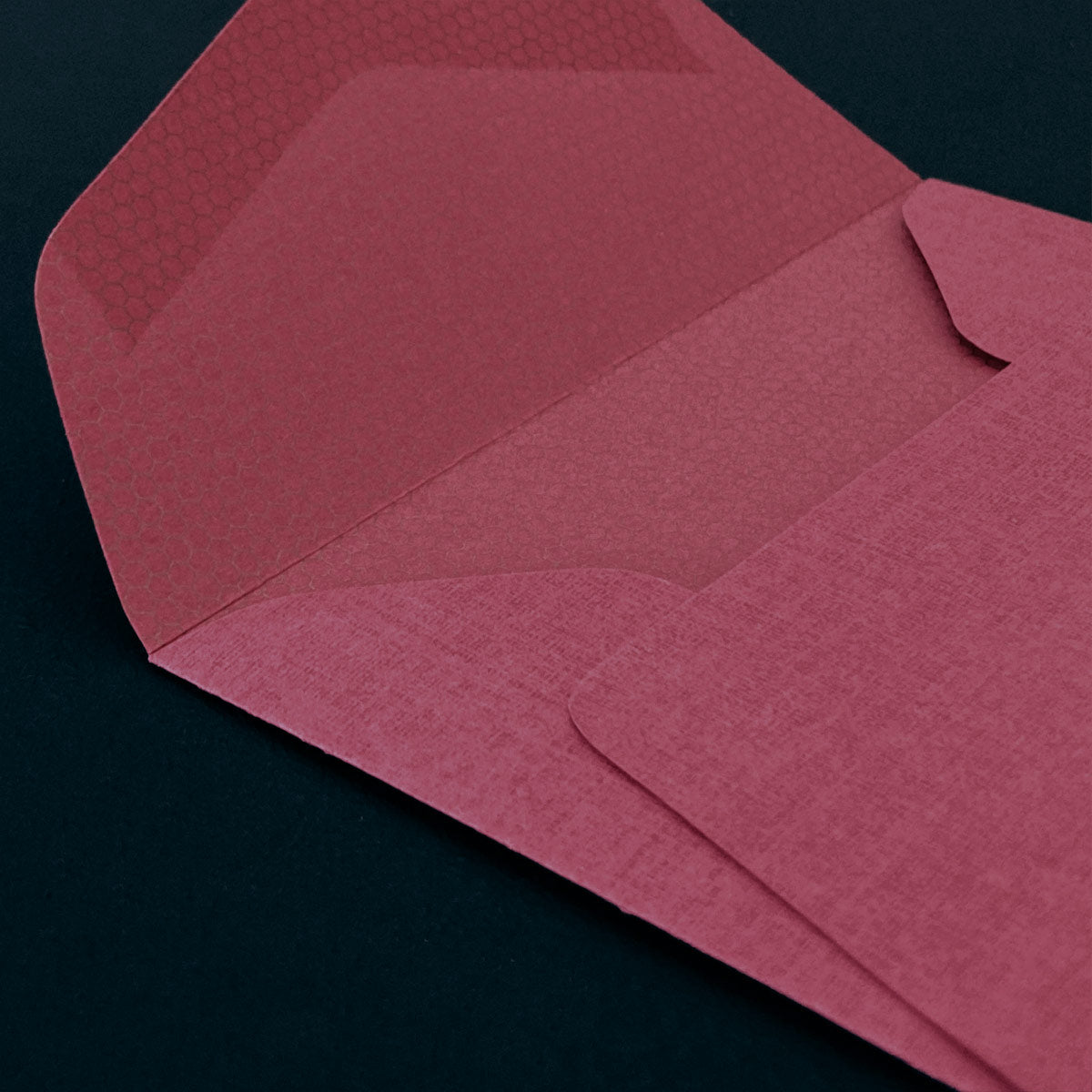 Close-up of a raspberry envelope on a dark background
