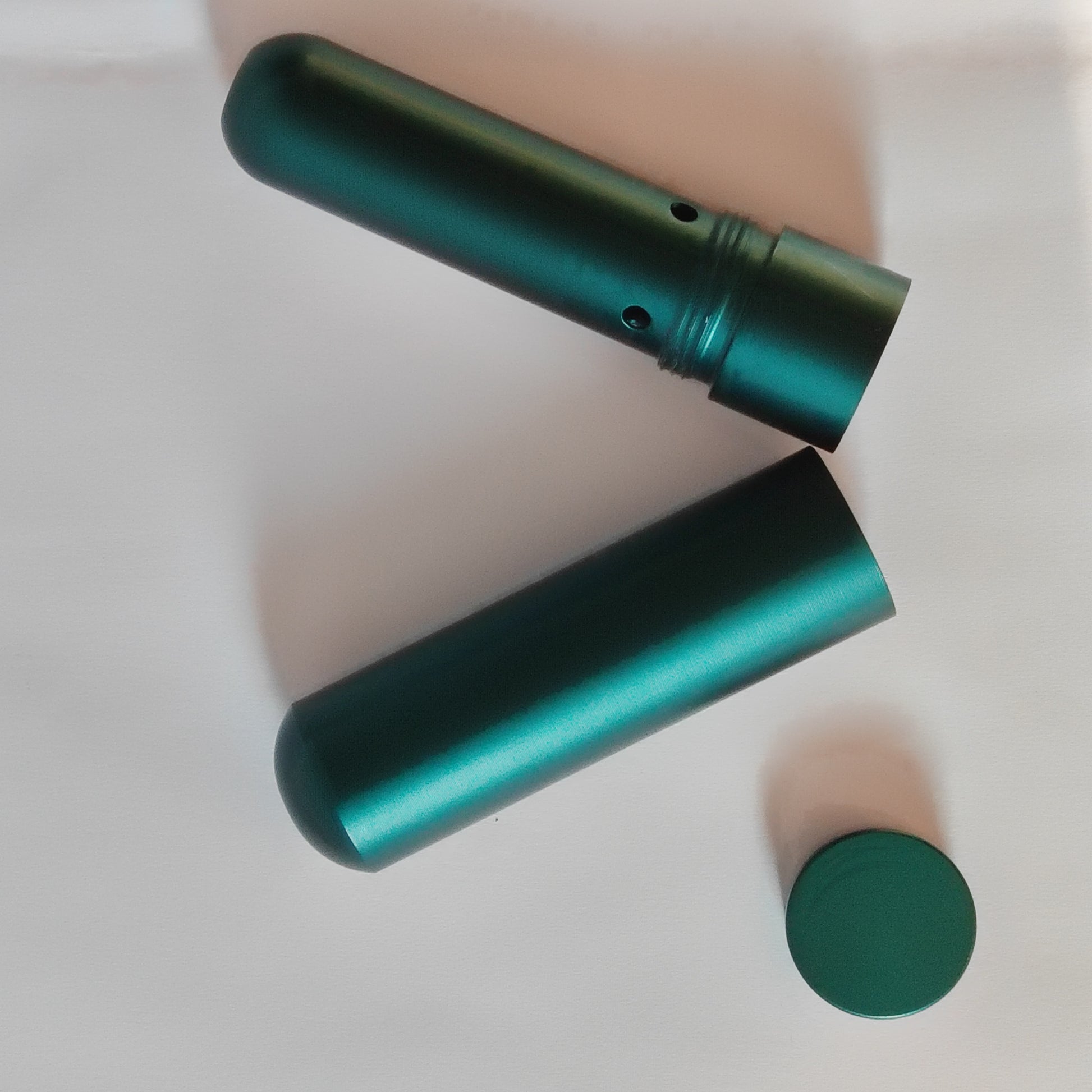 Two green nasal inhaler on a white background
