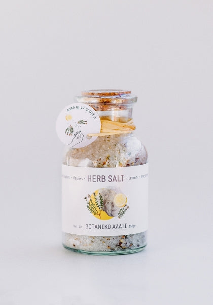 A jar of mixed greek herbs and sea salt with a cork lid. Natural mediterranean flavour for every dish. 
