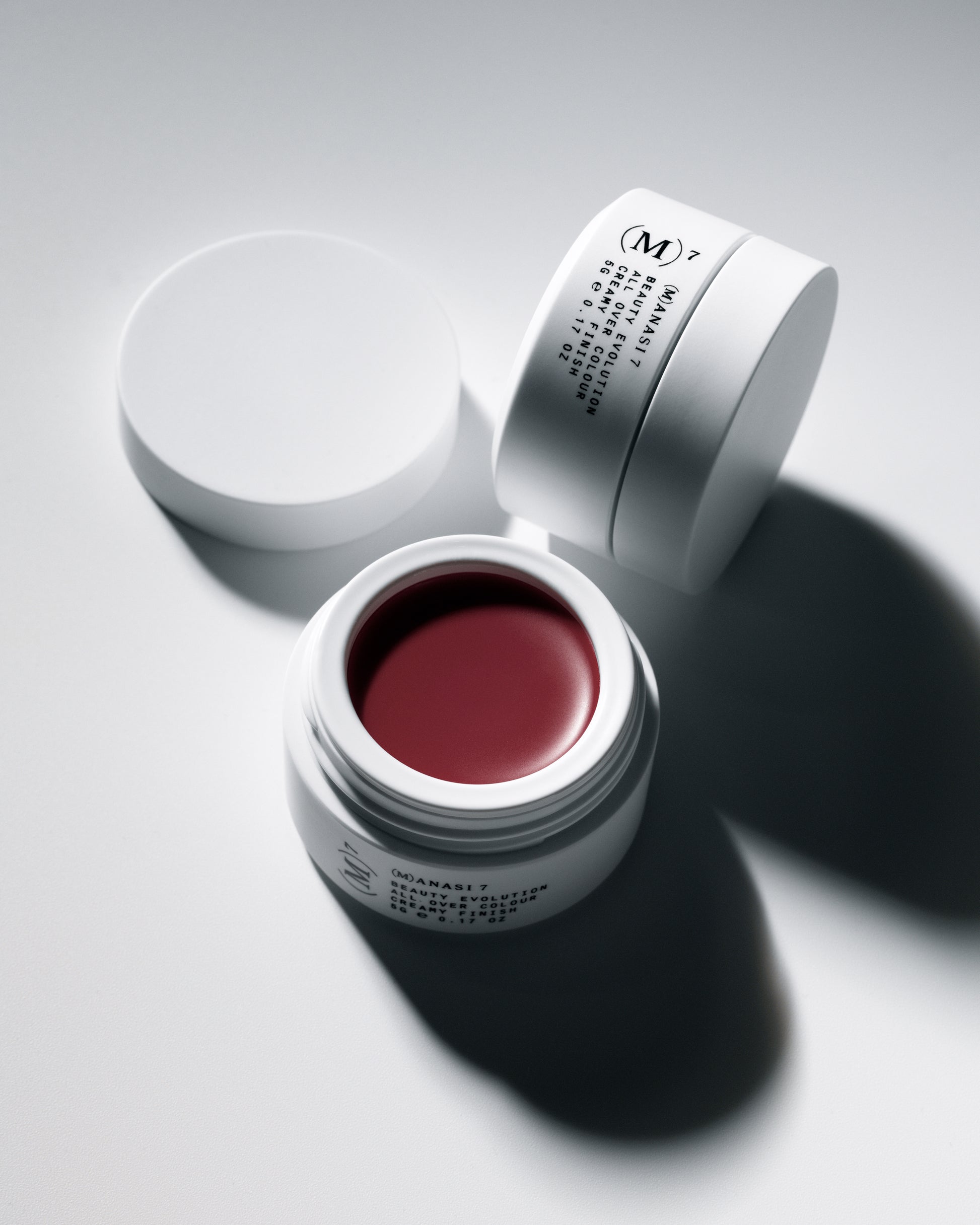 Two Manasi 7 Kuranberi All over Colour in  white containers on a white background