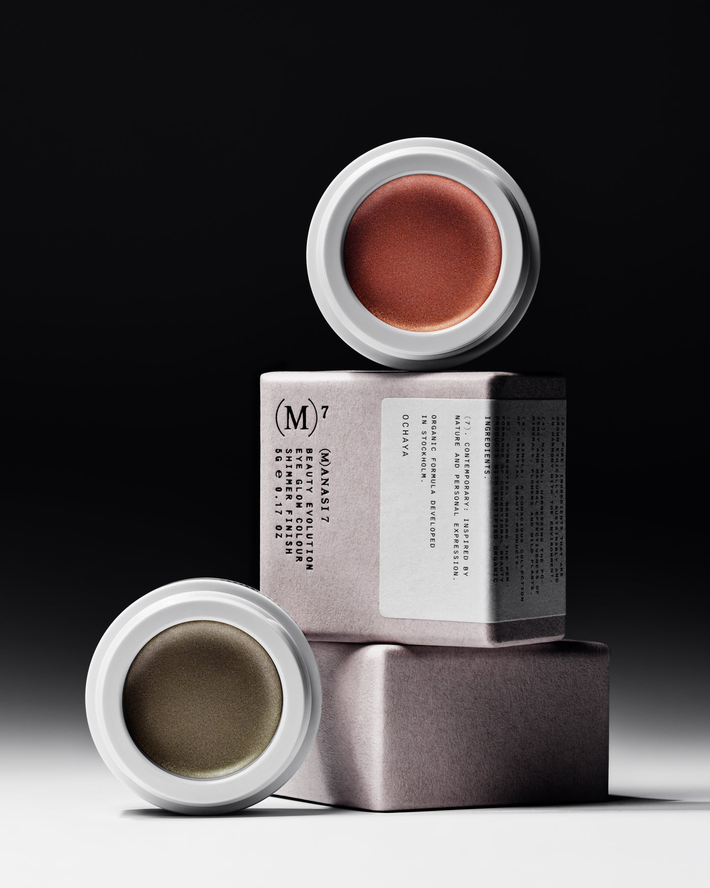 The Manasi 7 All over Colour in the sades Chaminade and Ochaya in white containers on top of their packaging