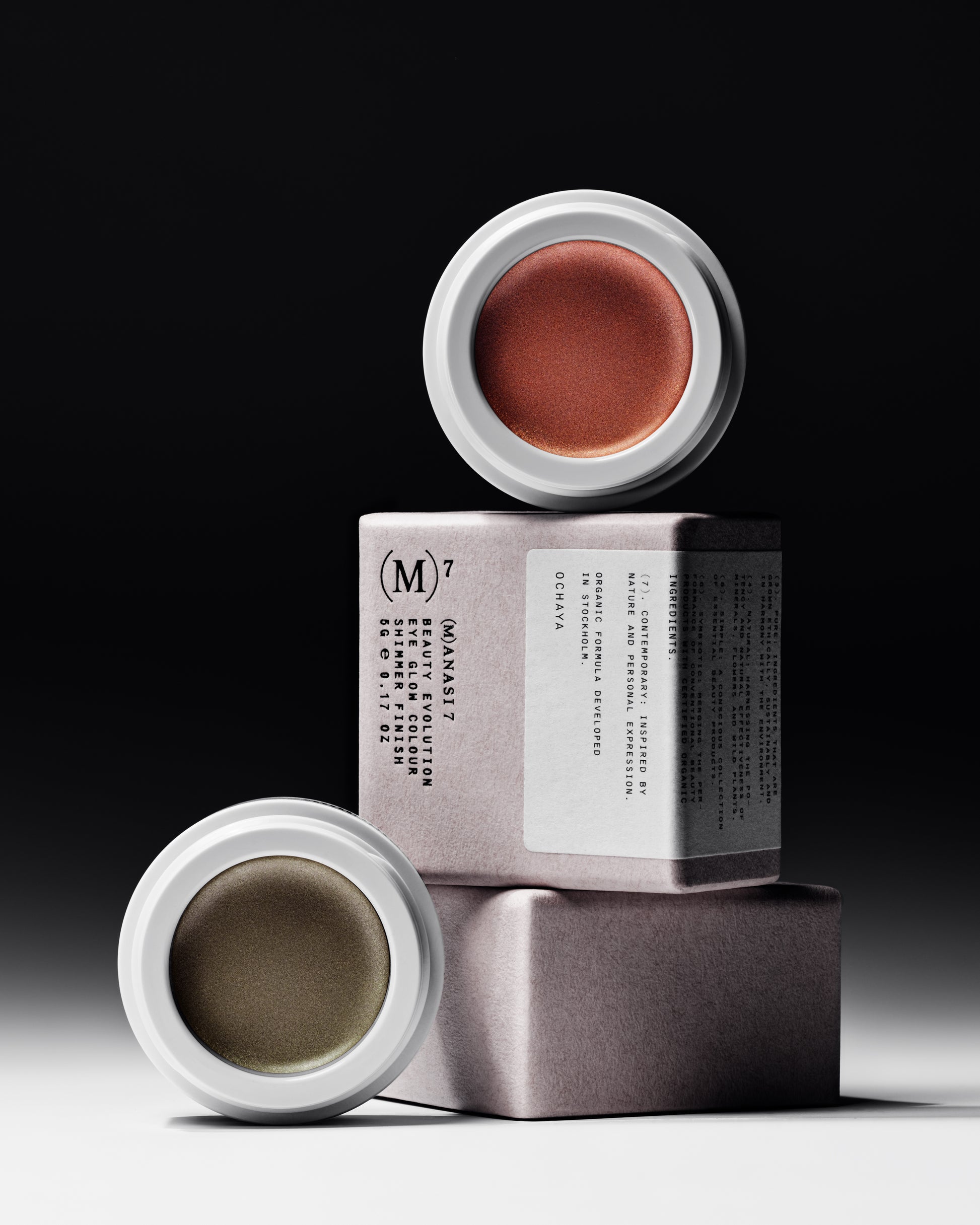 The Manasi 7 All over Colour in the sades Chaminade and Ochaya in white containers on top of their packaging