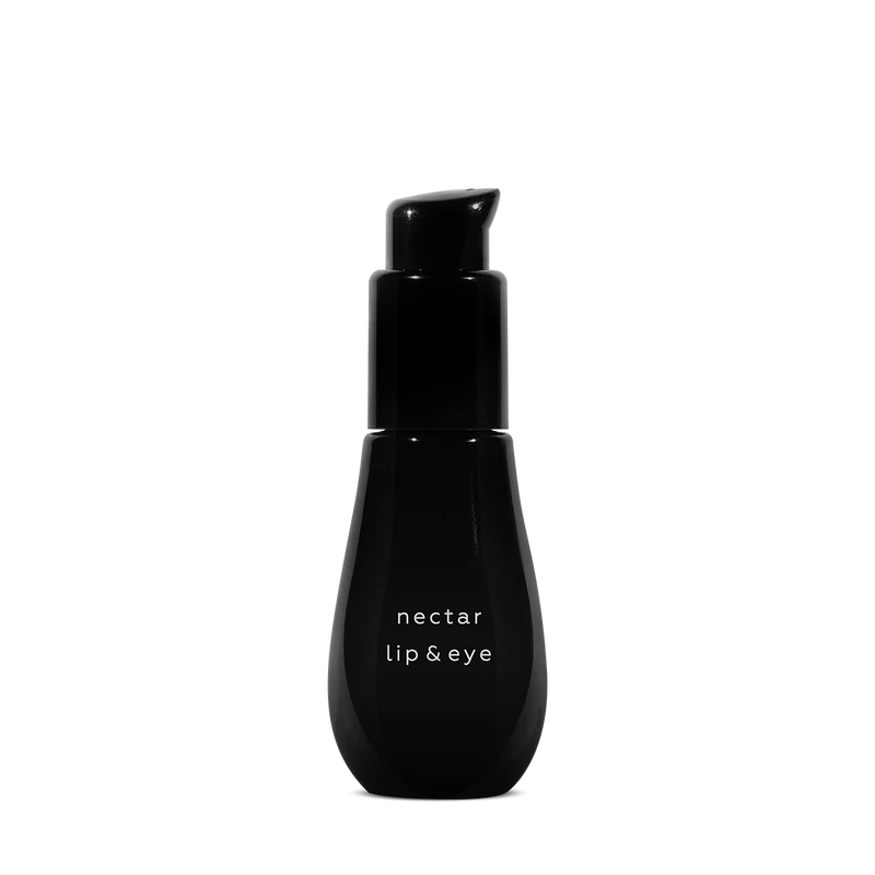 Black bottle labeled 'nectar lip & eye' by ayuna on a white background