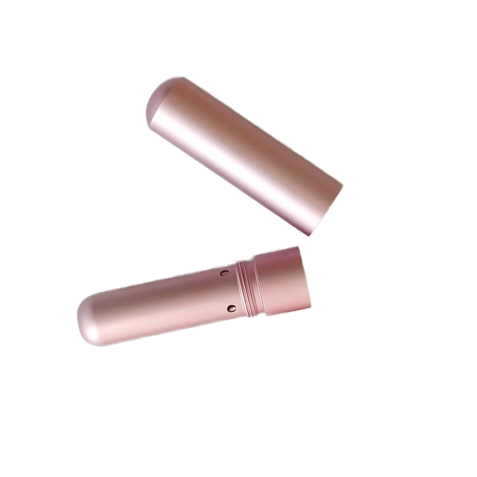 a pink nasal inhaler on a white background