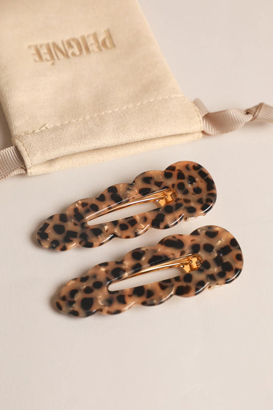 A set of two leopard hairclips for polished hairstyles. 