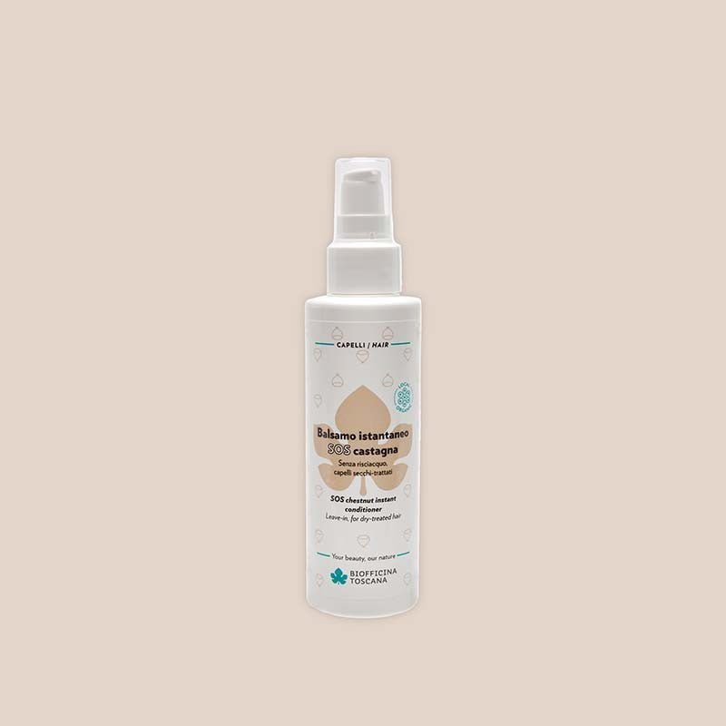 White spray bottle of the Biofficina Toscana SOS chestnut instant conditioner
with a label on a beige background