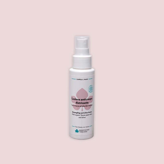 spray bottle of the untangling anti-friz lotion by biofficina toscana detangling