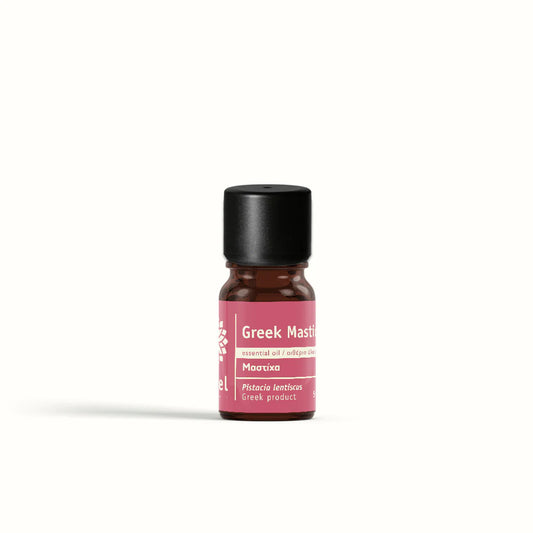Small mastic essential oil bottle by vessel with pink label on a white background