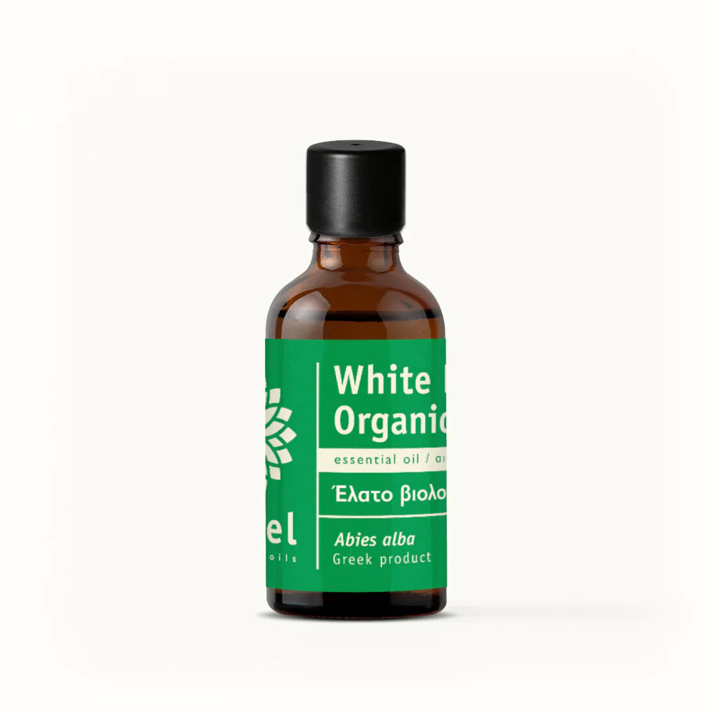 Bottle of White Organic essential oil by vessel with a green label on a white background